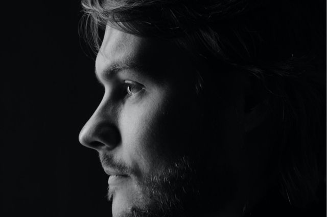 Black & white picture of an emotional man.